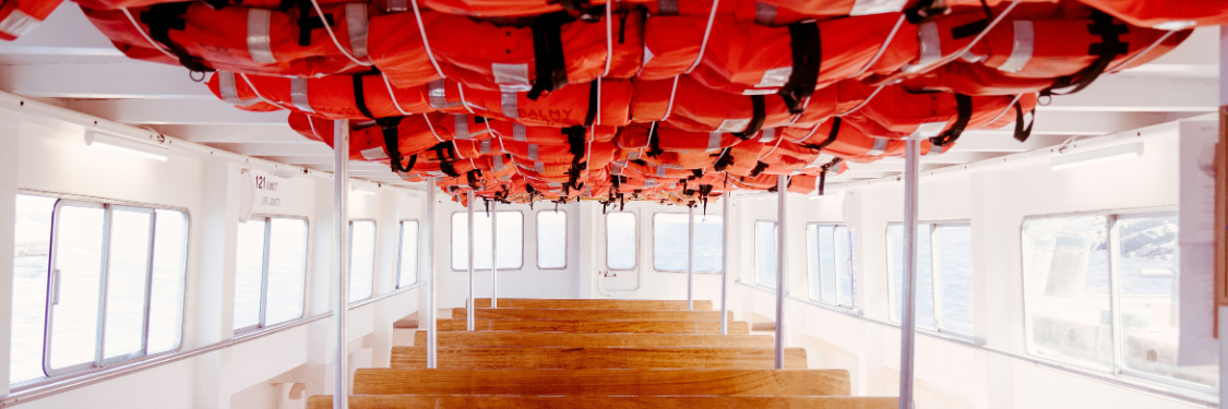 Stack of inflatable lifejackets on boa